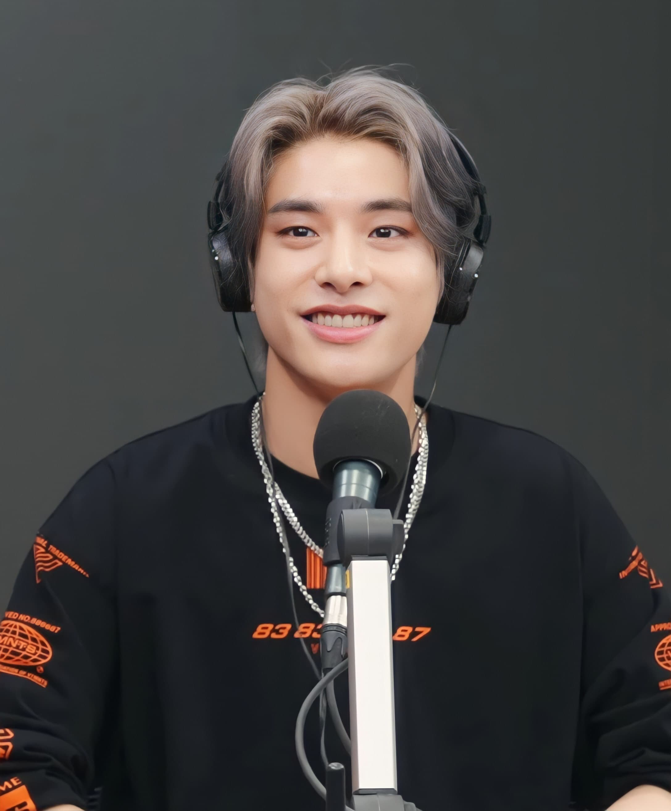 Jake sharing a bright smile with fans at fanmeeting event.
